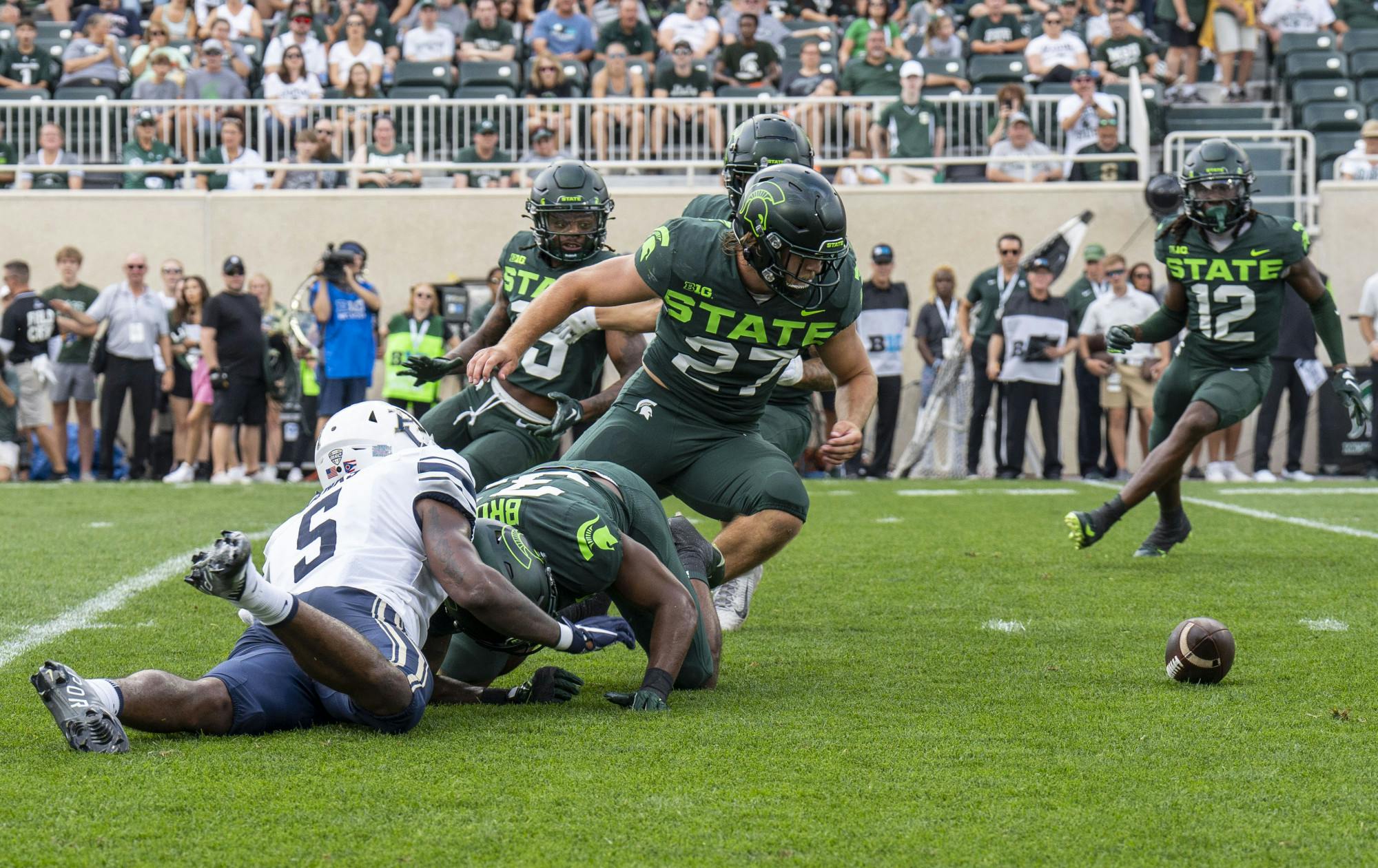 Redshirt sophomore linebacker Cal Haladay, 27, turns to pick up the Akron fumble during Michigan State’s game against the Zips on Sat., Sept. 10, 2022 at Spartan Stadium.