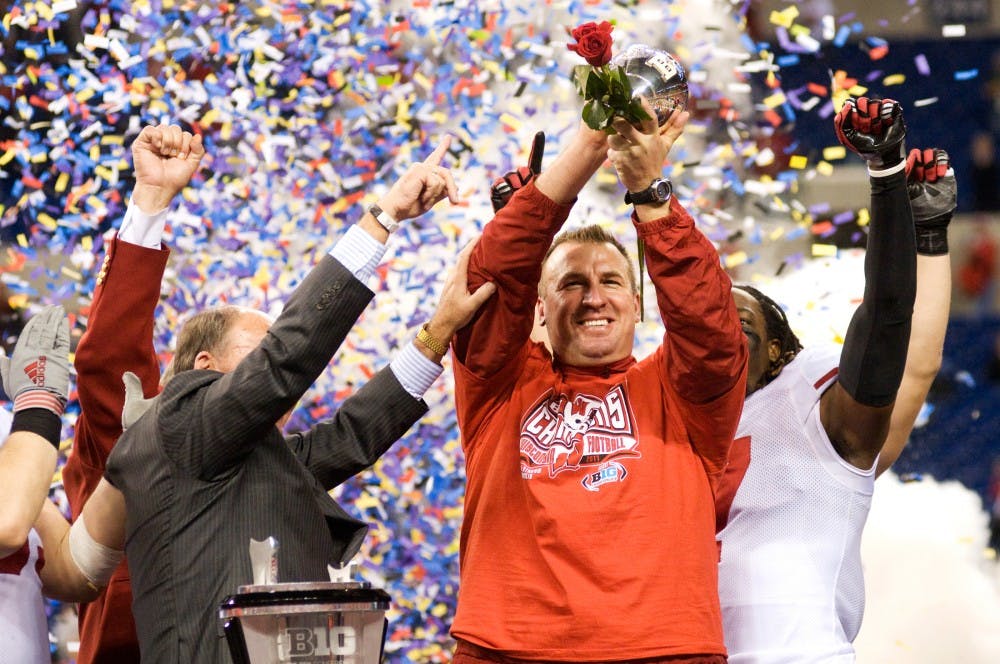 Wisconsin head coach Bret Bielema displays the Big Ten Championship trophy after a win against the Spartans. With a win in the Big Ten Conference, the Badgers has secured a trip to the Rose Bowl. The Wisconsin Badgers defeated the Spartans, 42-39, Saturday night at Lucas Oil Stadium in Indianapolis. Justin Wan/The State News