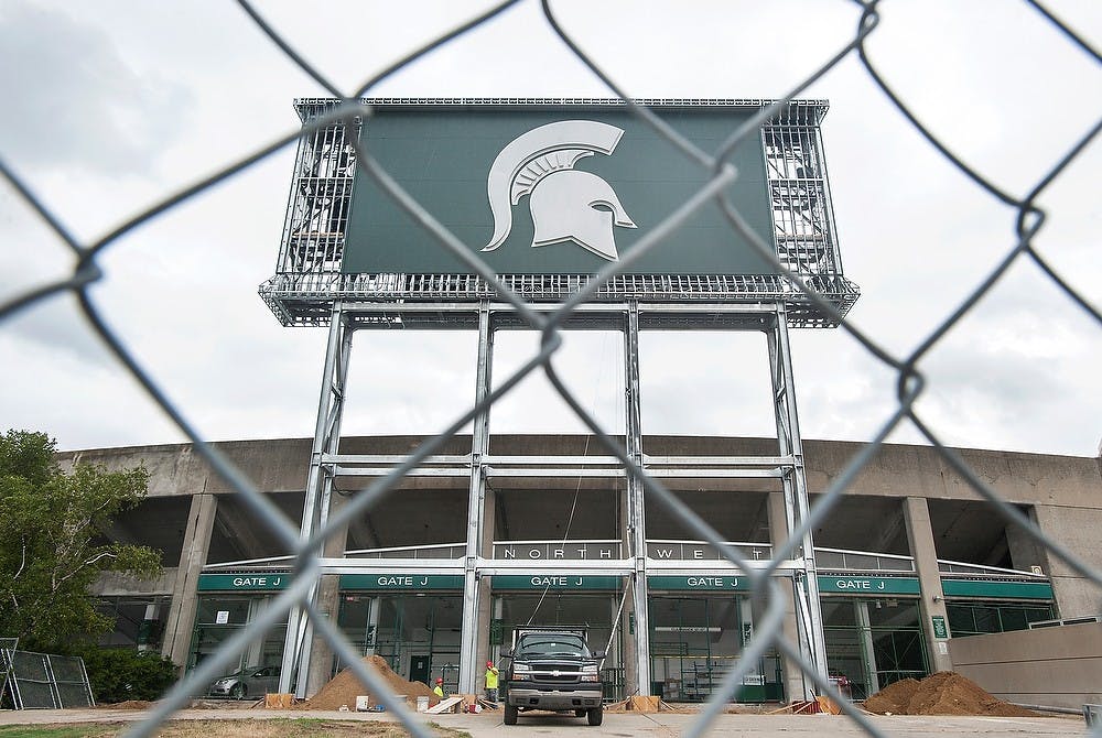 	<p>The new scoreboard at the northwest end of Spartan Stadium is near completion on Thursday, July 26. 2012. The $10 million project with three scoreboards surrounding Spartan Stadium will be used for the first time during the upcoming football season. State News File Photo</p>