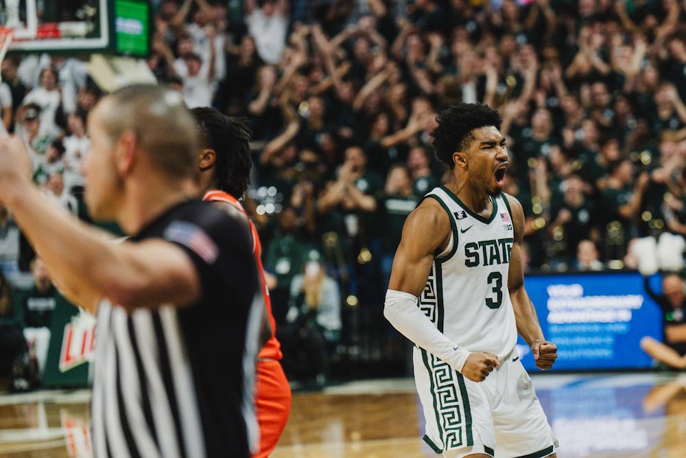 <p>MSU senior guard Jaden Akins (3) celebrates a three point score against Bowling Green at the Breslin Center on Nov. 16, 2024</p>