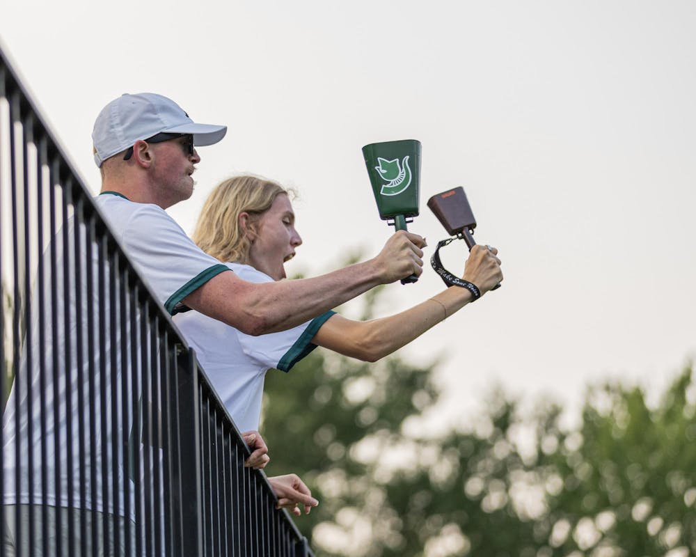 <p>Fans a part of the Red Cedar Rowdies bring cow bells and yell at an opposing player in an effort to distract them in DeMartin Stadium in East Lansing, Mich., on Aug. 12, 2026.</p>