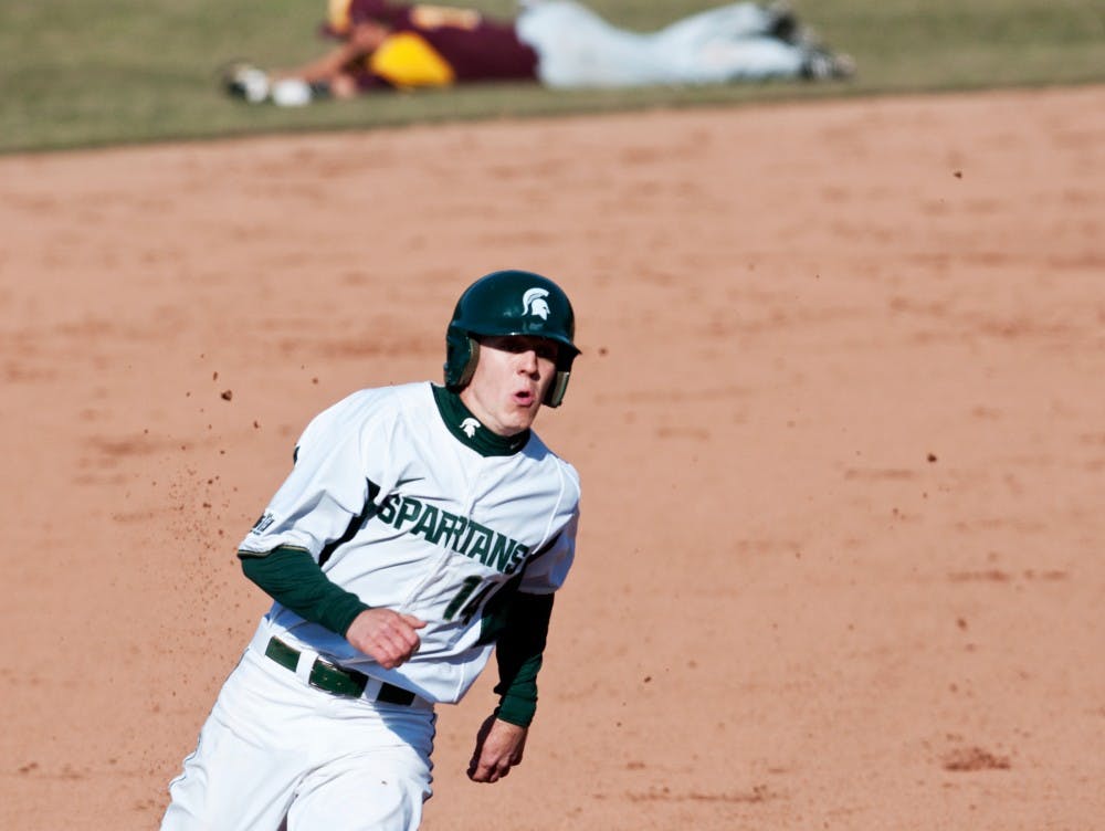 Senior outfielder Brandon Eckerle rounds third base on his way in for the Spartan's only run of the game against Central Michigan. The Spartans lost to the Chippewas, 3-1, on Wednesday at McLane Stadium at Kobb Field. Josh Radtke/The State News