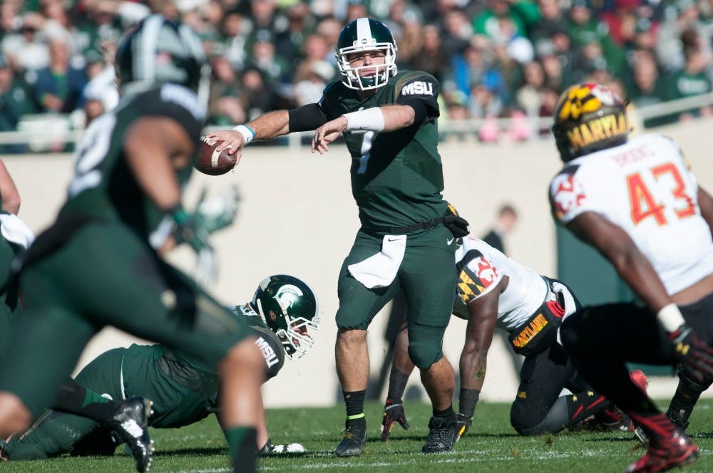 <p>Junior quarterback Tyler O'Connor looks to pass to junior wide receiver R.J. Shelton, left in the foreground, during the game against Maryland on Nov. 14, 2015 at Spartan Stadium. The Spartans defeated the Terrapins, 24-7.</p>
