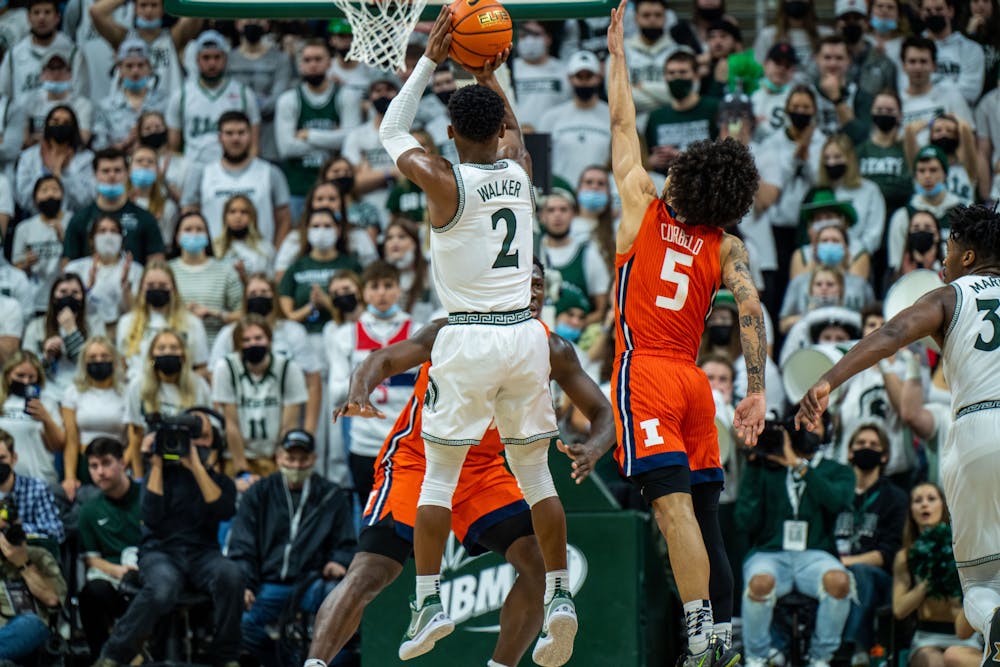 Junior guard Tyson Walker shoots a three-pointer over the Illinois defense. The Spartans fell to the Illini 79-74 at the Breslin Center on Feb 19, 2022.