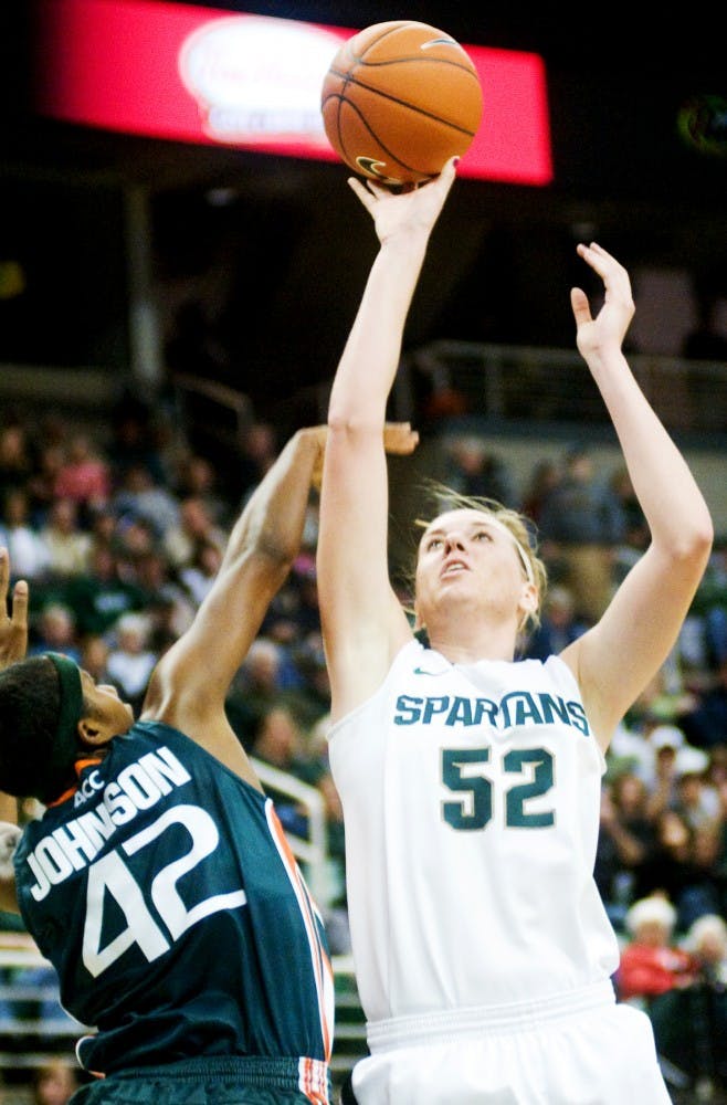 Senior forward Becca Mills shoots a two-pointer by the baseline. Miami defeated the Spartans, 76-60, Thursday night at Breslin Center. Justin Wan/The State News