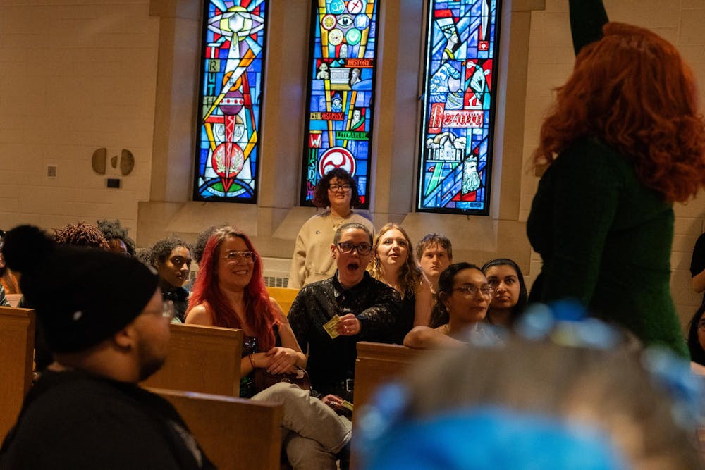 <p>Students reacts in awe as drag artist Jordan Michelle interacts with the crowd on April 13.</p>