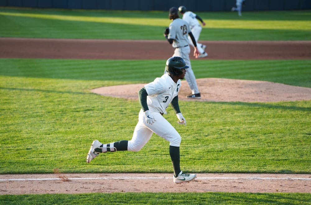 Michigan State junior outfielder Zaid Walker (3) running after hitting a double to left center in the bottom of the fourth. Michigan State won 7-4 against Purdue Fort Wayne at the McLane Stadium, on Apr. 27, 2022.
