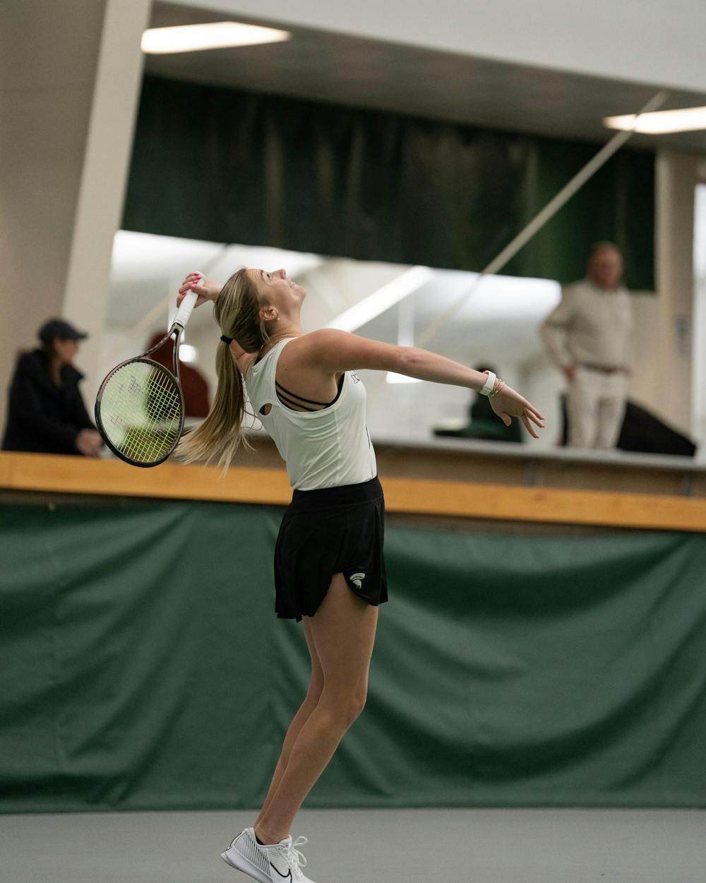 <p>MSU junior Issey Purser serves against Xavier in a singles match at the MSU Indoor Tennis Center on Jan. 24, 2025. Purser went on to lose the match.</p>