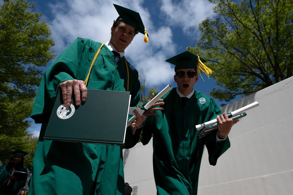 Graduates walk out of the Breslin Center tunnel after commencements on May 3, 2025.