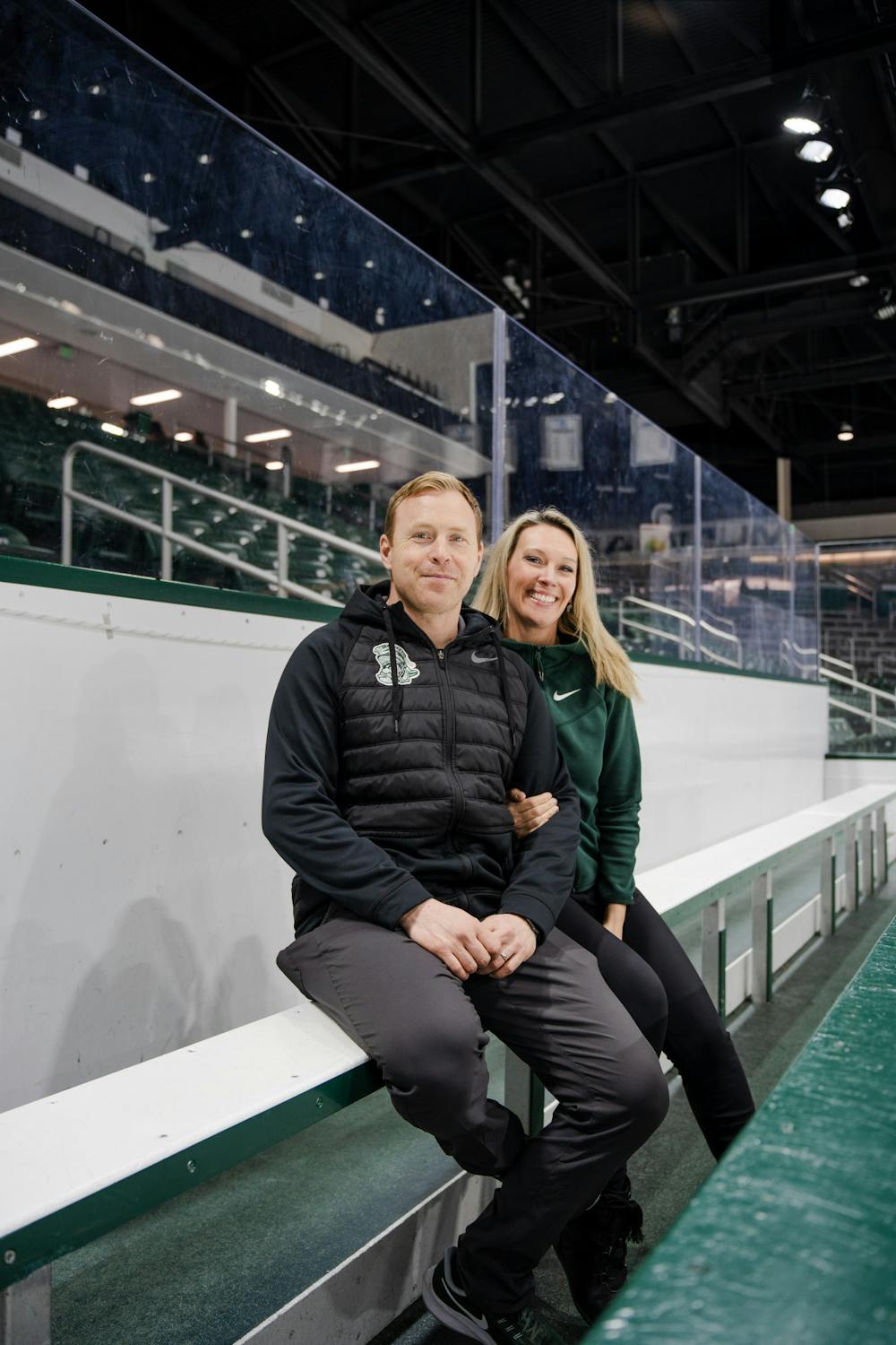 <p>MSU Men’s Hockey Director of Player Development Brad Fast with his wife and Men’s Hockey Executive Secretary Lindsay Fast on Mar. 22, 2023.</p>