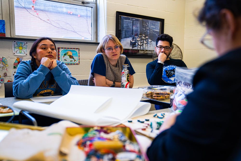 Event participants pay attention to a demonstration during a beading workshop held at the Urban Planning and Landscape Architecture building on Nov. 19, 2024.