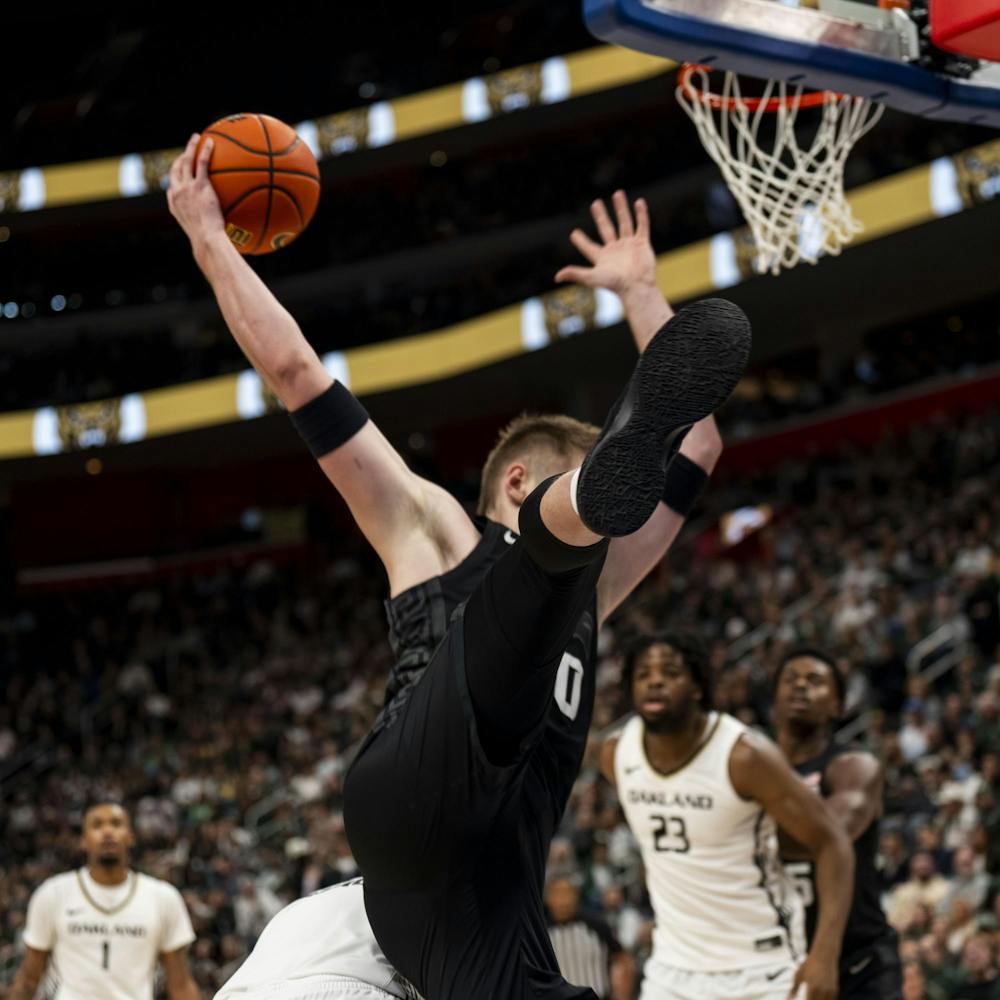 <p>Michigan State junior forward Jaxon Kohler (0) gets a hold of the ball at the Little Caesars Arena in Detroit on Dec. 17, 2024. The Spartans defeated the Golden Grizzlies 77-58.</p>