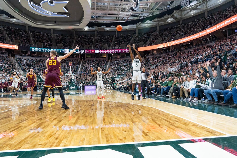 Spartan guard Trey Holloman shoots a three pointer at the Breslin Center in East Lansing on Thursday, Jan. 18, 2024. Holloman recorded 8 points in 22 minutes of play during the Thursday evening matchup.