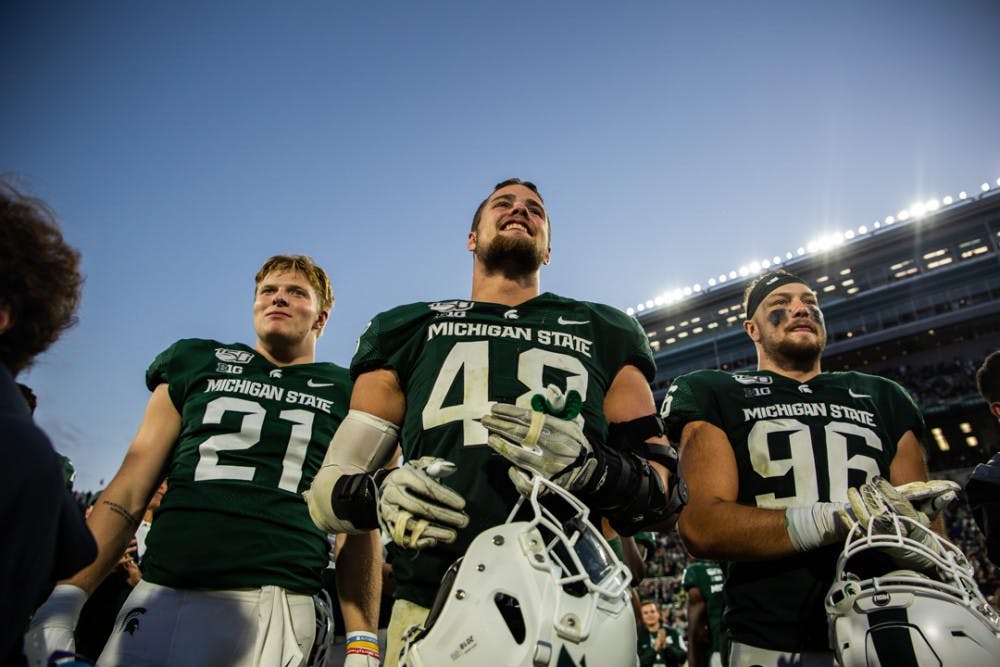 Spartans watch as head coach Mark Dantonio is honored for his wins after the homecoming game against Indiana on Sept. 28, 2019 at Spartan Stadium. The Spartans beat the Hoosiers, 40-31.