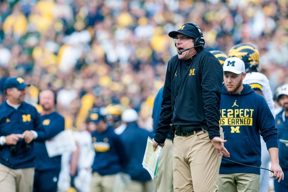 Michigan head coach Jim Harbaugh reacts to a call by the referees during the game against the University of Michigan on Oct. 29, 2016 at Spartan Stadium. The Spartans were defeated by the Wolverines, 32-23.
