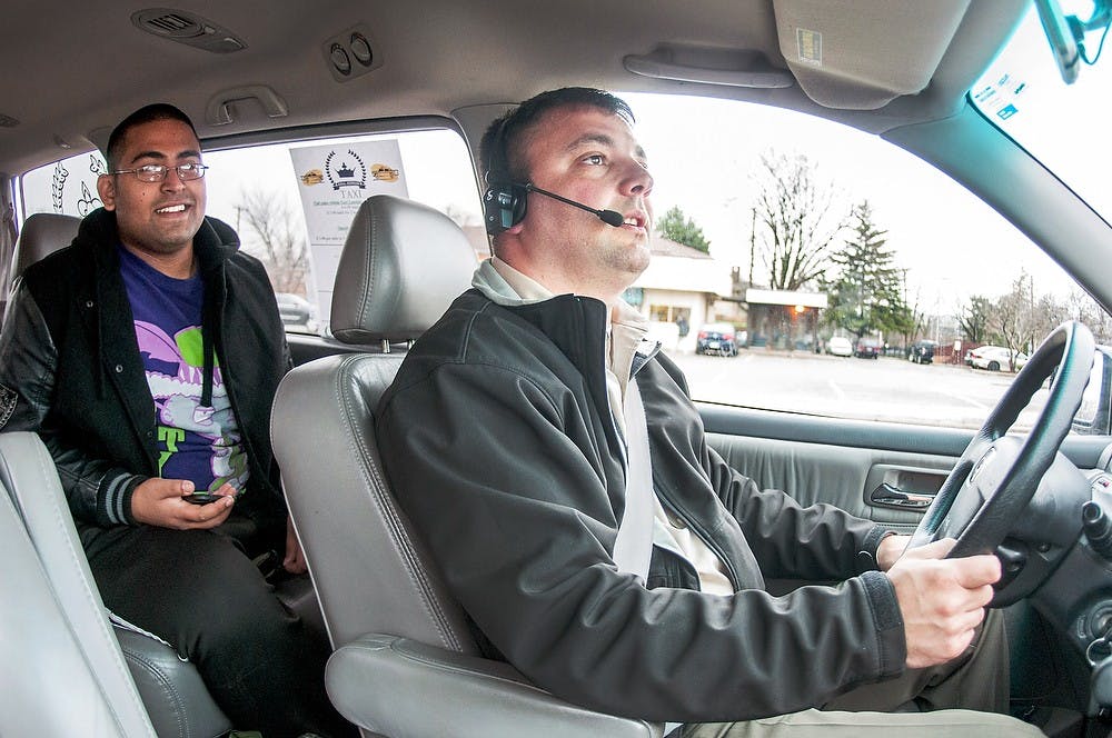 	<p>Owner of Royal Express Taxi Vartan Muradov drives Asad Khan on April 11, 2013 to the Amtrak station, 1240 S. Harrison Road. Muradov said clarifying requirements of &#8220;good moral character&#8221; for cab driver applicants makes sense to him because it’s important to have drivers on the road who can be trusted.</p>