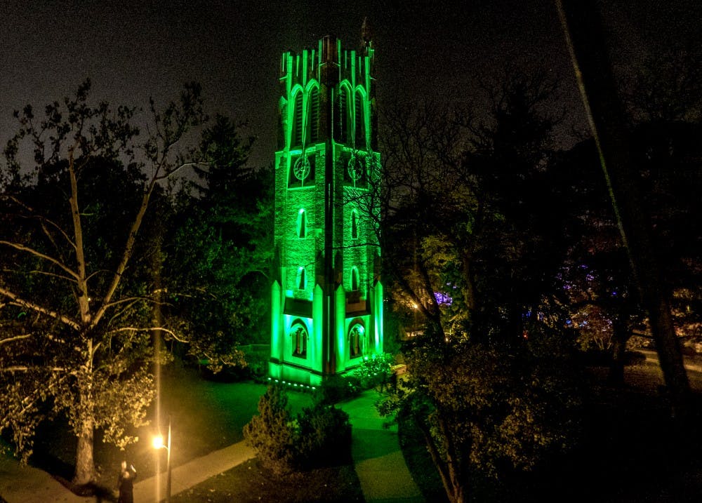 <p>The Beaumont Tower is "Glowing Green" in honor of MSU homecoming week. Photo courtesy of MSU Photography Services</p>