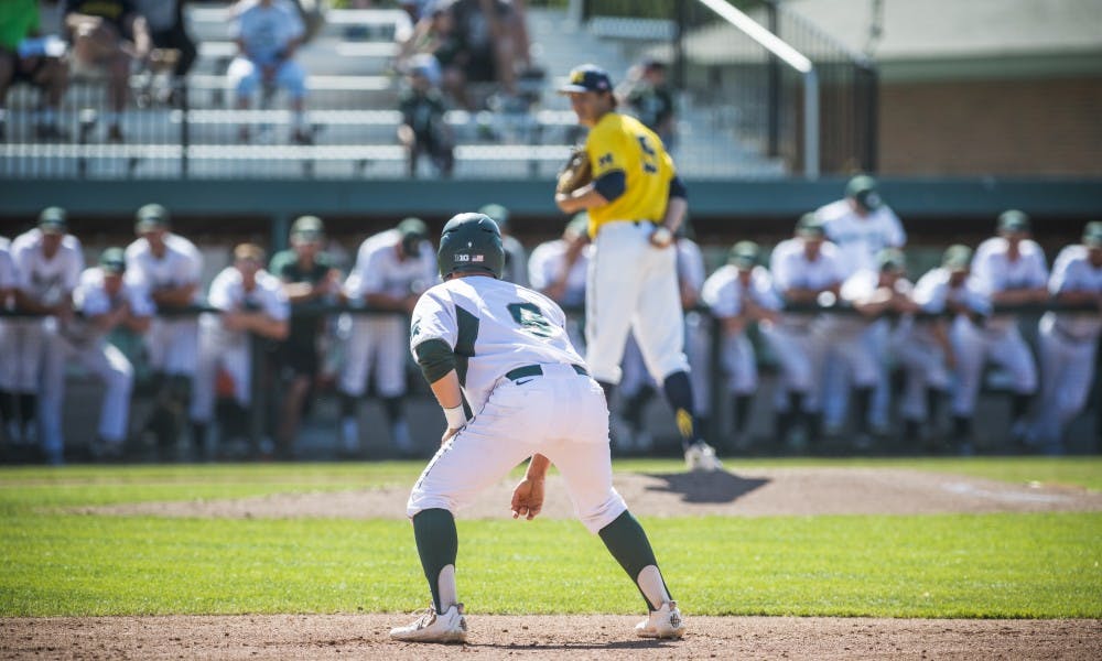 Senior second baseman Dan Durkin (9) leads off from first base during the the game against the University of Michigan on May 18, 2017 at McLane Baseball Stadium at Kobs Field. The Spartans defeated the Wolverines 6-1.