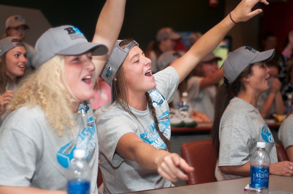 	<p>Freshman forward/midfielder Jessica Albers, left, sings along with junior back Jenni Smith, right, while waiting for the <span class="caps">NCAA</span> Selection Showing on Nov. 10, 2013, at Berkowitz Basketball Complex. The Spartans, after winning the Big Ten Tournament, were selected to play against Miami (OH) at home on Wednesday, Nov. 13. Danyelle Morrow/The State News</p>
