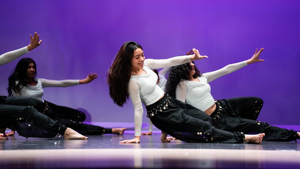 <p>Michigan State students with the Coalition of Indian Undergraduate Students participate in a dance performance during the CISU's annual Satrang dance show at Everett High School in Lansing, Michigan on March 30, 2024. The show boasted dances inspired by hip-hop and Bollywood and featured a theme of bright colors, unity and joy.</p>
