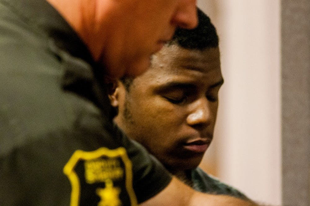 Marquez Dominique Cannon,17, from Eastpointe, Mich. leaves the courtroom Tuesday morning, July 3, 2012 at 54B district court 101 Linden Street.  Cannon has been charged in the death of former MSU freshman Olivia Pryor. Adam Toolin/The State News