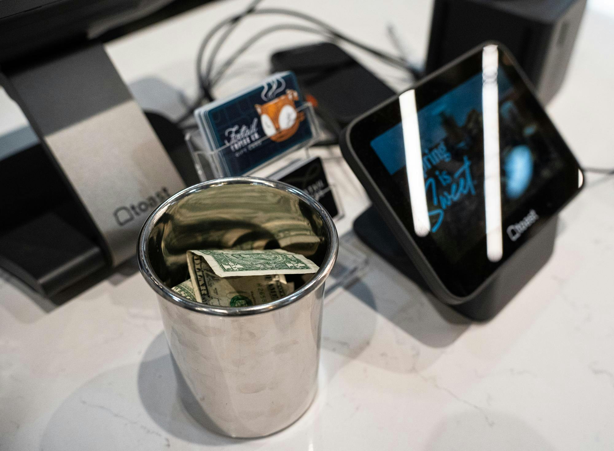 <p>Tip options sit alongside the register at Foxtail Coffee Co. on Grand River Avenue in East Lansing, Michigan, on April 1, 2026.</p>