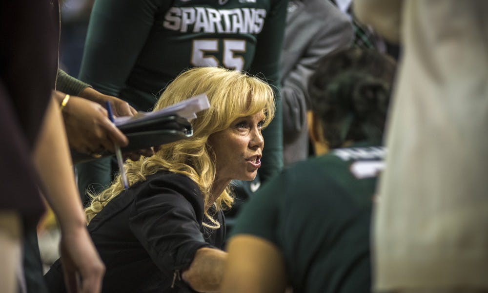 Head coach Suzy Merchant talks to the team during the women's basketball game against the University of Michigan on Feb. 19, 2017 at Crisler Arena in Ann Arbor, Mich. The Spartans defeated the Wolverines, 86-68.