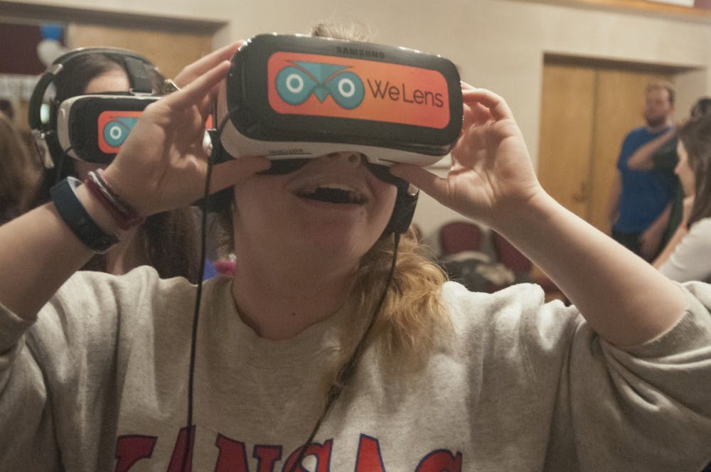 Physiology freshman Megan Ernsteen uses a virtual reality device on Nov. 16, 2016 in the Union. One scene available was a highway next to the Red Sea.