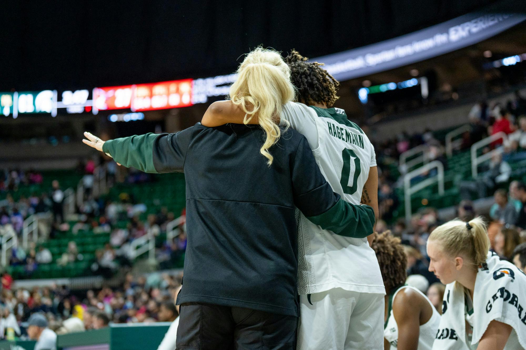 <p>Head women's basketball coach Suzy Merchant coaches sophomore guard DeeDee Hagemann during the Spartans' 86-37 win over Delaware State on Nov. 7.</p>