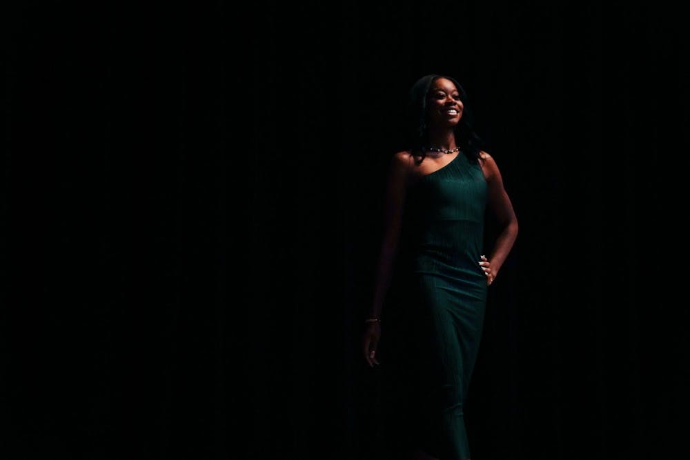 <p>Kinesiology junior and contestant Jenessa Ediagbonya makes her first appearance at the Miss Black &amp; Old Gold Scholarship Pageant presented by the Alpha Phi Alpha Fraternity at the Kellogg Hotel &amp; Conference Center on Nov. 10, 2023.</p>