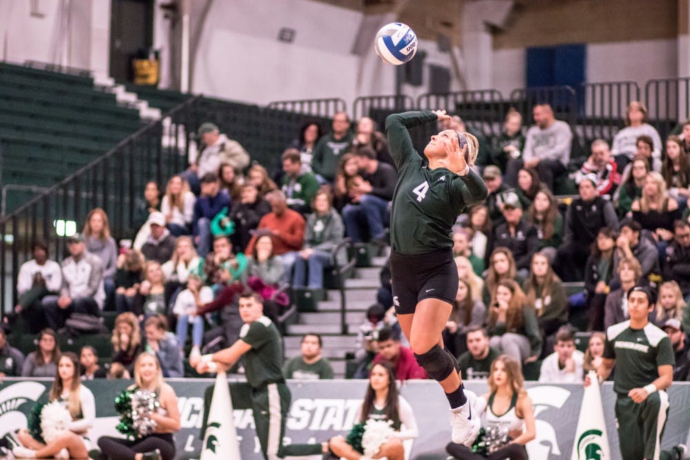 Freshman libero Jayme Cox (4) serves a ball during the game against Indiana on November 18, 2017, at Jenison Fieldhouse. The Spartans defeated the Hoosiers, 3-0.