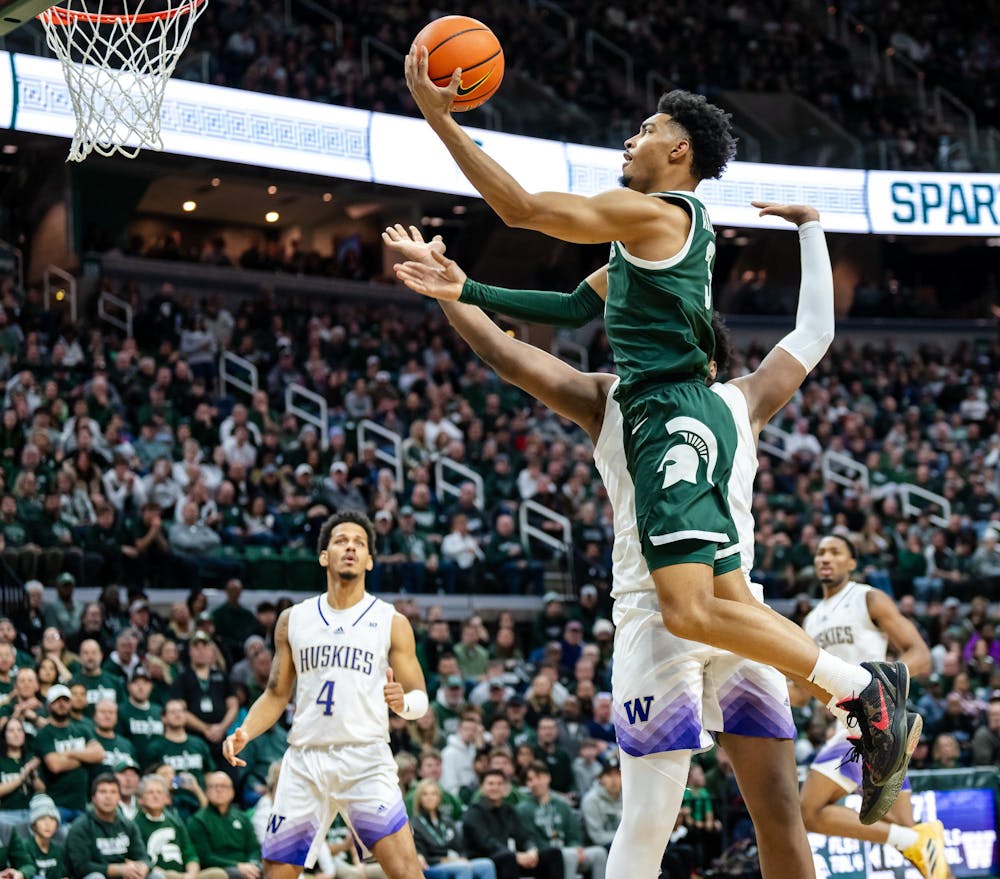 Michigan State senior guard Jaden Akins (3) goes for a layup during a game against the University of Washington at the Breslin Center in East Lansing, Michigan on January 9, 2025. Michigan State won 88-54.