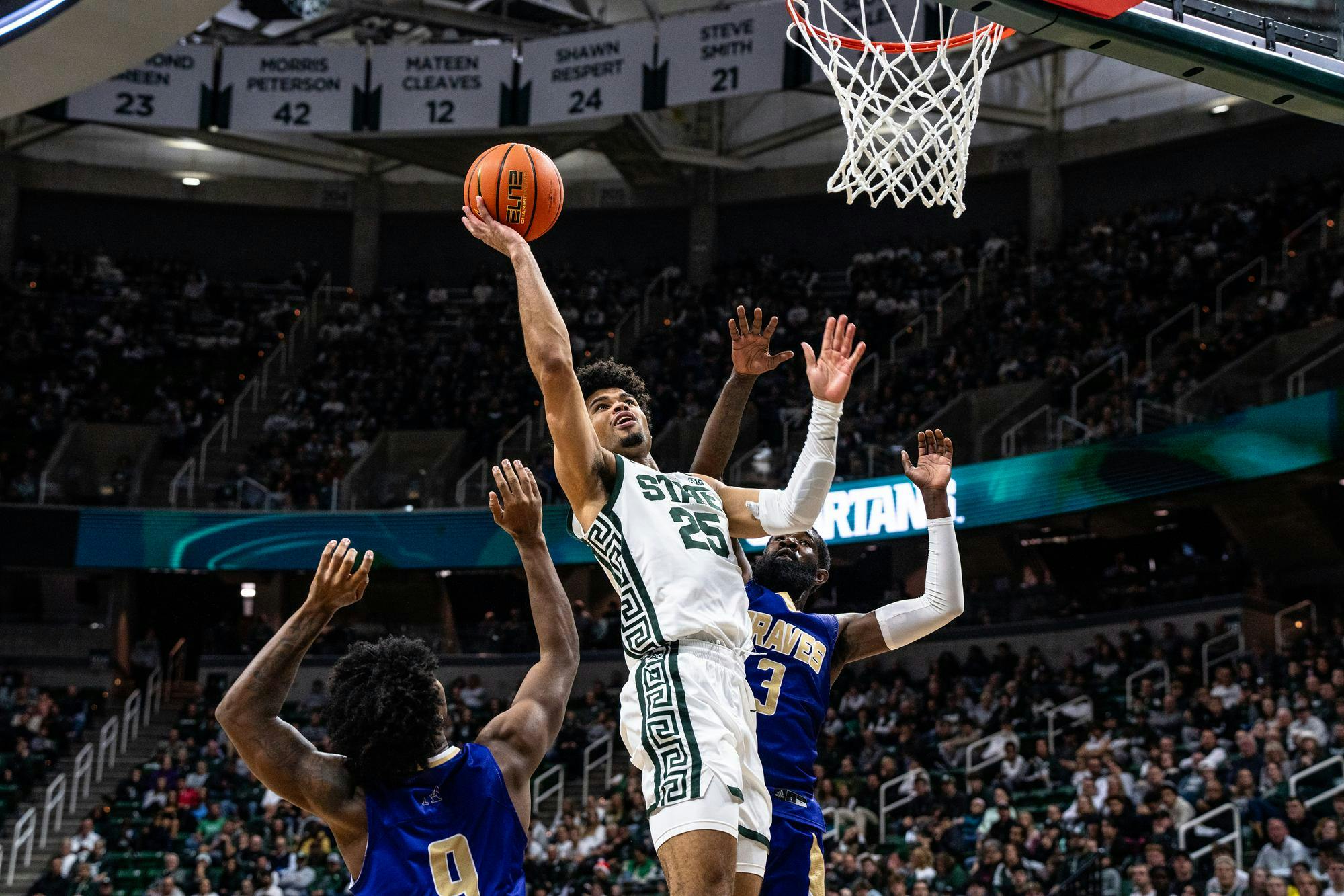 <p>Michigan State University graduate student forward Malik Hall (25) scoring at the game against Alcorn State University at the Breslin Center on Nov. 19, 2023. </p>