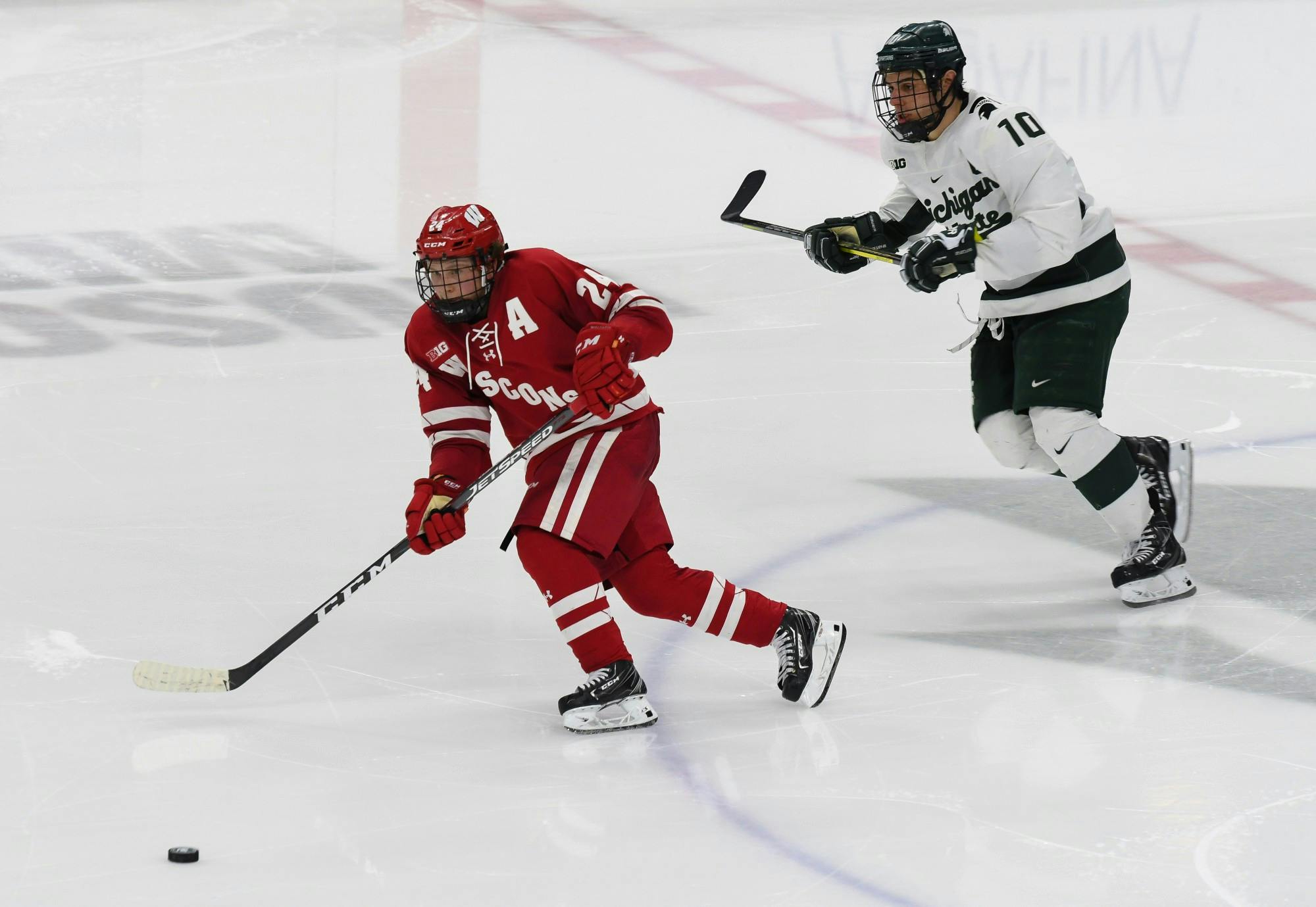 Senior Forward Sam Saliba (10) chases the puck during the game against Wisconsin at the Munn Ice Arena on December 6, 2019.  The Spartans defeated the Badgers 3-0.