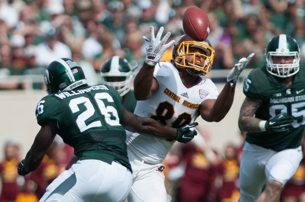 <p>Central Michigan tight end Ben McCord fails to complete a catch with pressure from senior safety RJ Williamson applied on him in the second quarter during the game against Central Michigan on Sept. 26, 2015, at Spartan Stadium. The Spartans defeated the Chippewas, 30-10. Julia Nagy/The State News </p>