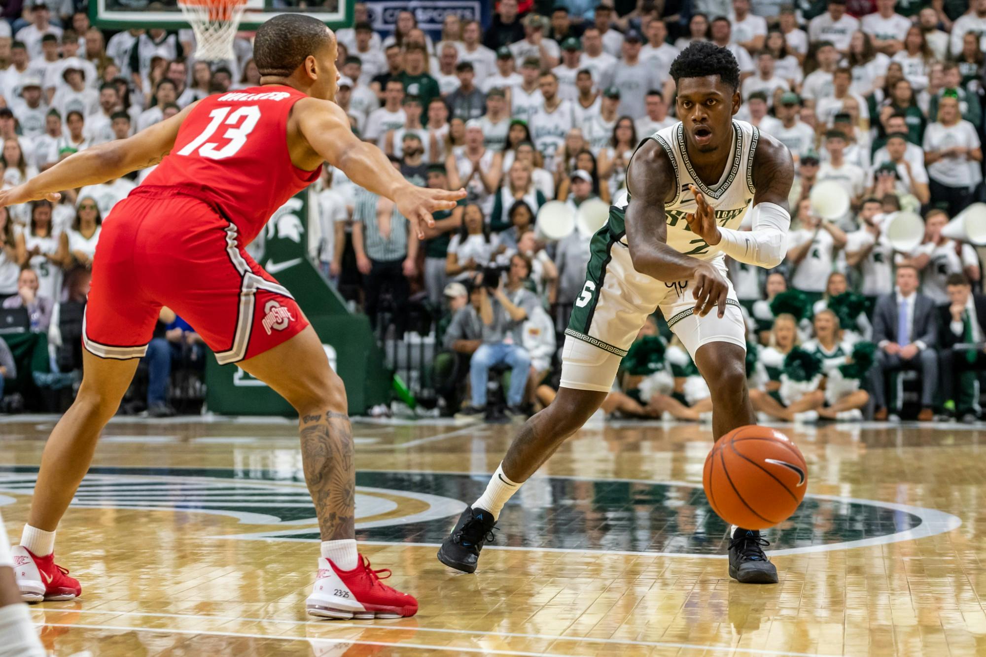 <p>Sophomore guard Rocket Watts (2) passes the ball during a game against Ohio State.</p>