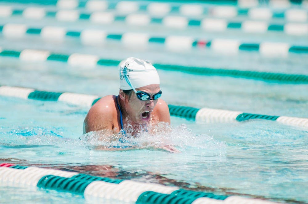 Sara Swanton, of Saginaw, Mich. swims laps at the IM West outdoor pool Sunday, July 1, 2012.  With summer temperatures rising, more people are coming to the pool to cool off and get some exercise. Adam Toolin/The State News