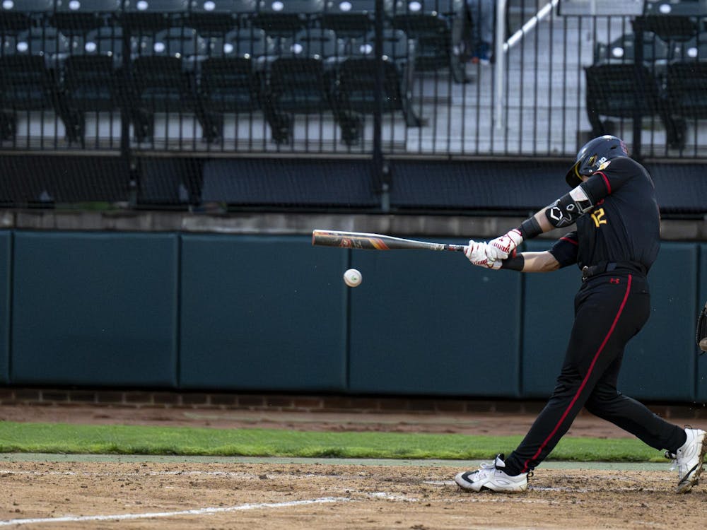 <p>Maryland redshirt junior Devin Russell connects with the ball at Jeff Ishbia Field at McLane Baseball Stadium in East Lansing, Mich., on Friday, April 24, 2026. </p>