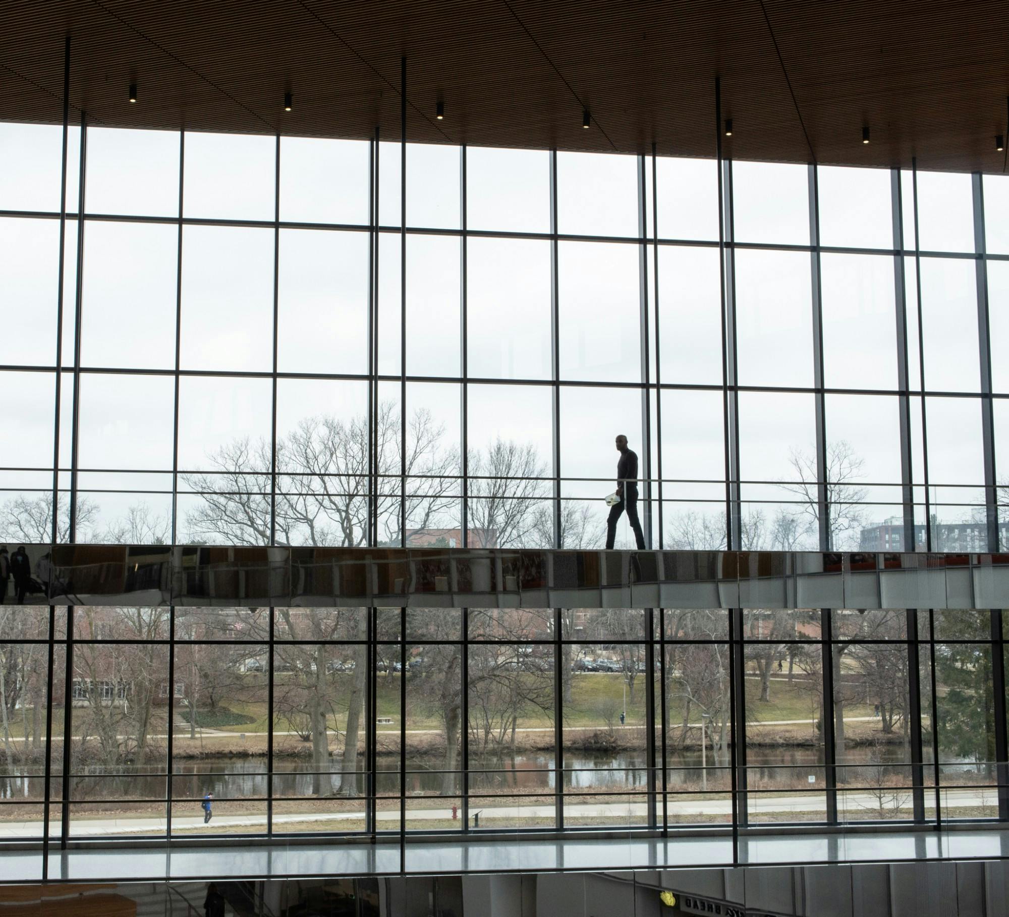 <p>A student walks through the Eppley Center after an email is released on March 11 notifying students that classes have been canceled due to growing concerns of COVID-19. </p>