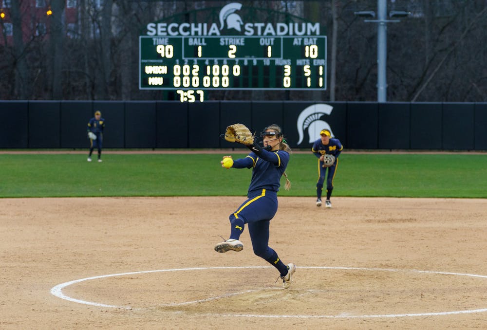 <p>Michigan senior pitcher Alex Storako (8) pitching the the Spartans in the bottom of the seventh. Michigan State lost 3-0 to Michigan at the Secchia Stadium, on April 19, 2022.</p>