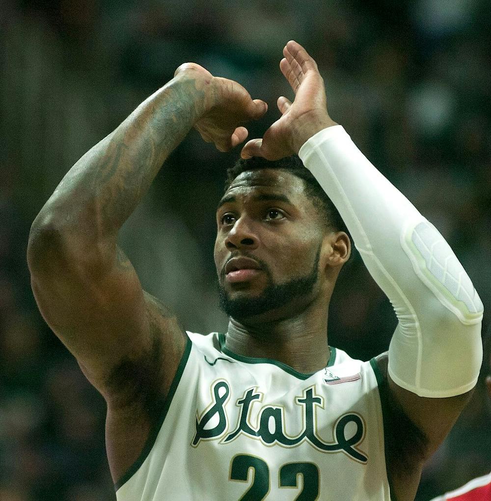 <p>Senior guard/forward Branden Dawson practices his form before shooting a free throw Feb. 14, 2015, during the game against Ohio State at Breslin Center. The Spartans defeated the Buckeyes, 59-56. Erin Hampton /The State News</p>
