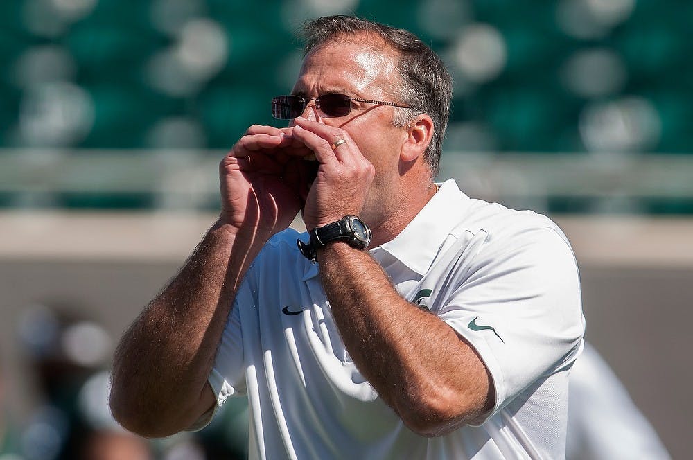 	<p>Assistant head coach/defensive coordinator Pat Narduzzi shouts during warmups Sept. 14, 2013, at Spartan Stadium. Julia Nagy/The State News</p>