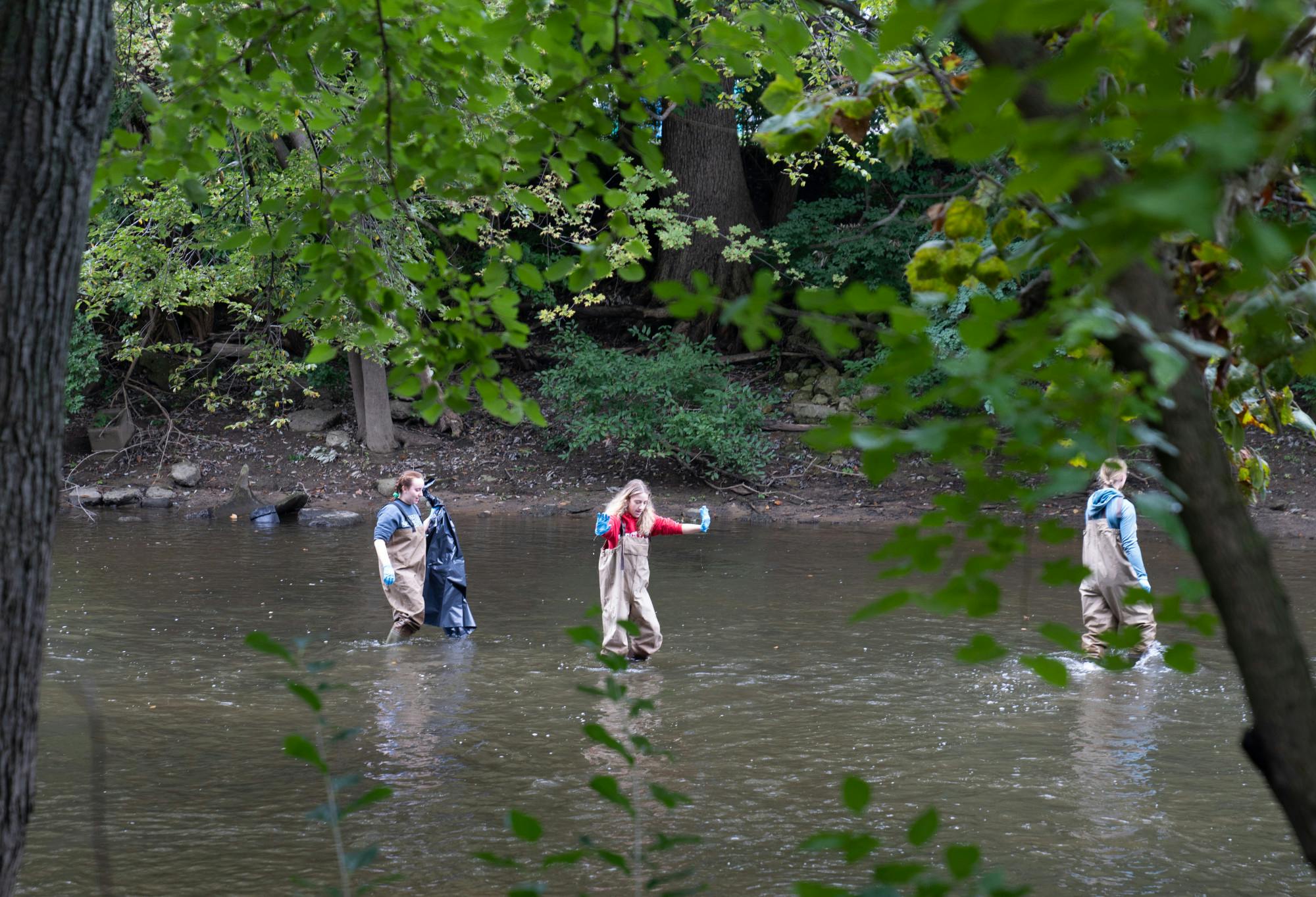 MSU Outdoor Club members clean up the Red Cedar river on Sept. 25, 2022. Members put their waders and gloves on, grabbed a trash bag and headed into the river at 10 a.m. 
