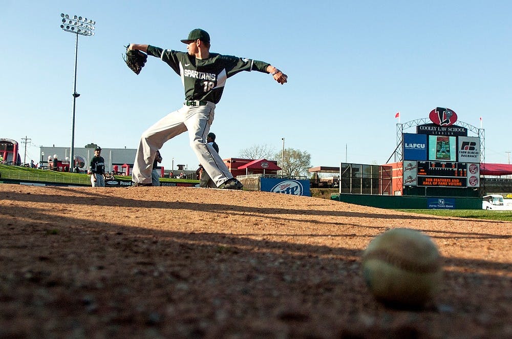 <p>Then-freshman pitcher Anthony Misiewicz warms up before the seventh annual Crosstown Showdown against the Lansing Lugnuts on May 1, 2013, at the Cooley Law School Stadium in Lansing. The Spartans lost 10-2.</p>