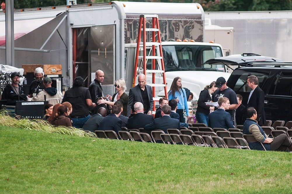 <p>Members of the Batman v Superman crew prepare for filming Oct. 15, 2014, at the Broad Art Museum. Streets and sidewalks have been blocked off with high security around the museum's premises. Raymond Williams/The State News</p>