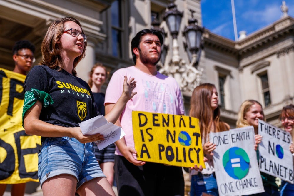 <p>Environmental biology sophomore Lea Dyga speaks at the Global Climate Strike at the Capitol building in Lansing Sep. 20, 2019.</p>