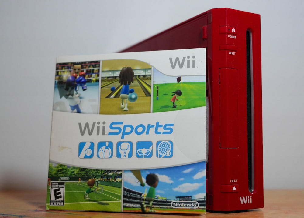 <p>A copy of Wii Sports sits next to a red Nintendo Wii console on a table in East Lansing, Michigan on Feb. 7, 2026. </p>