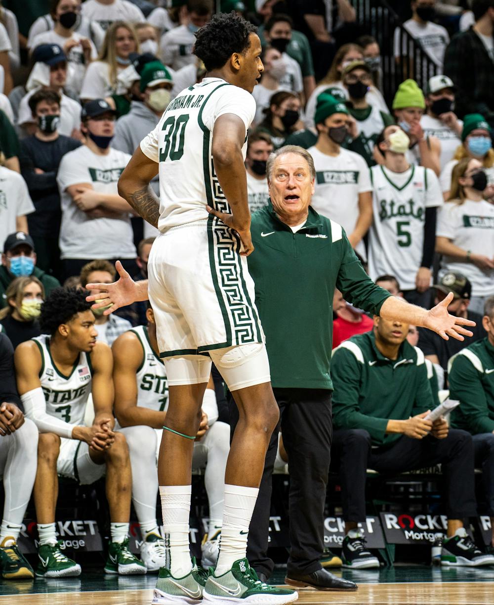 <p>Coach Tom Izzo has a talk with senior forward Marcus Bingham Jr. (30) during the second half of the game. The Spartans fell to the Badgers, 70-62, at Breslin Student Events Center on Feb. 8, 2022. </p>