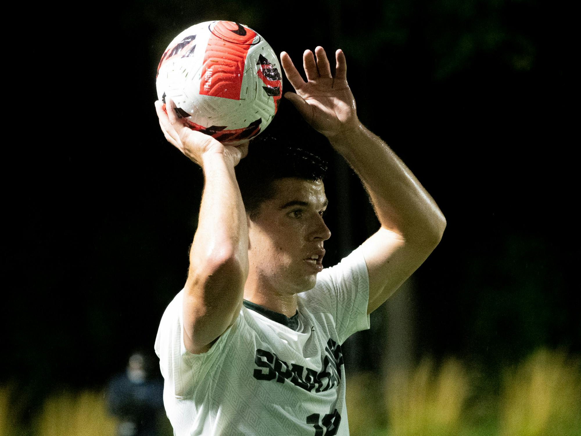 <p>Graduate student midfielder Michael Miller throws the ball in. Michigan State men&#x27;s soccer team defeated Duquesne 1-0 on Sept. 21, 2021 in East Lansing.</p>