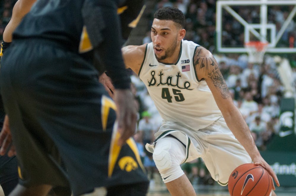 Senior forward Denzel Valentine drives the ball to the net during the game against Iowa on Jan. 14, 2016 at Breslin Center. The Spartans the were defeated by the Hawks, 76-59.